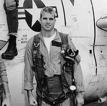 Lieutenant McCain standing by a T-2 Buckeye trainer, 1965